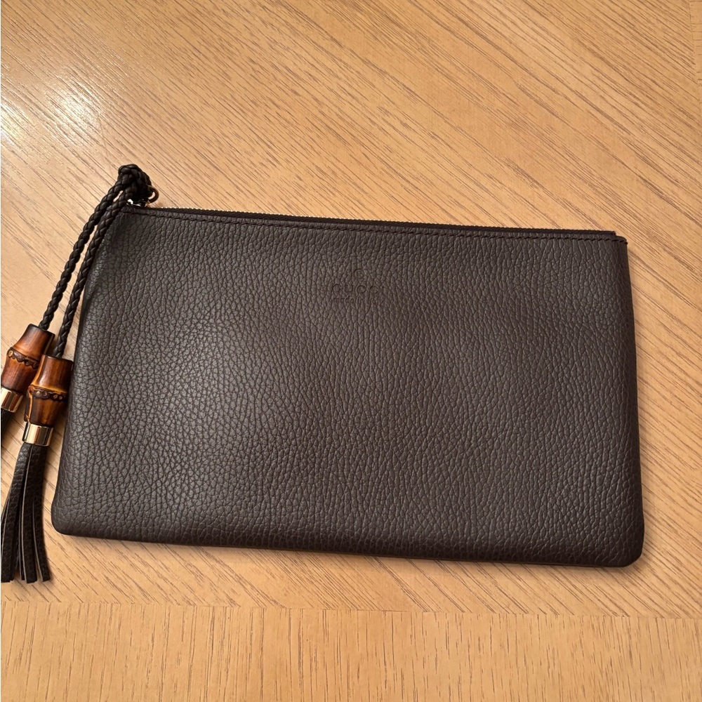 Gucci dark brown pebbled leather large clutch  new Never used